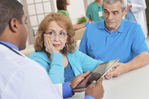 The most important thing that men can do is to get tested on an annual basis and catch prostate cancer early and stop it in its tracks.;Husband & Wife at Doctor's Appointment