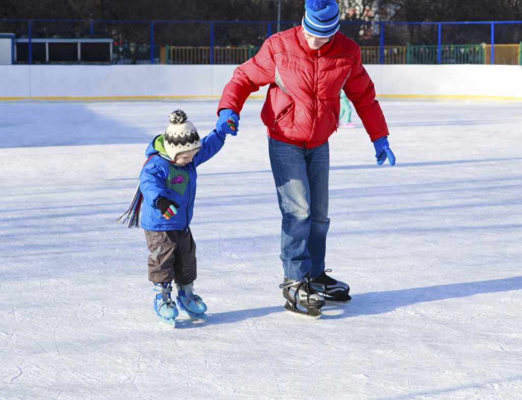 Dad Ice Skating with Son