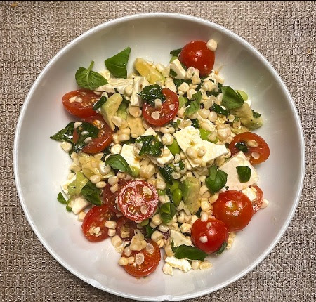 Corn Salad with Cherry Tomatoes, this recipe is adapted from one in “Pizza Night,” it also makes a nutrition-packed meal on its own.