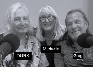 Three people smiling by microphones