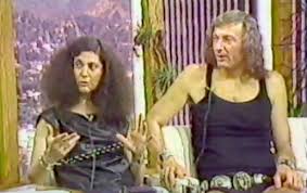 Two individuals discussing on a talk show.